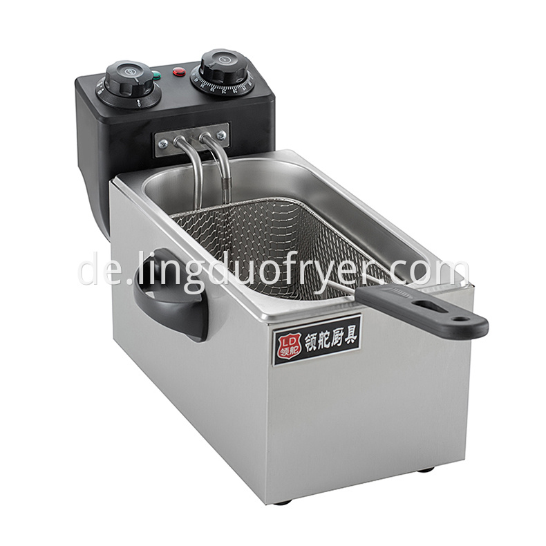 Professional electric fryer is used in snack bar